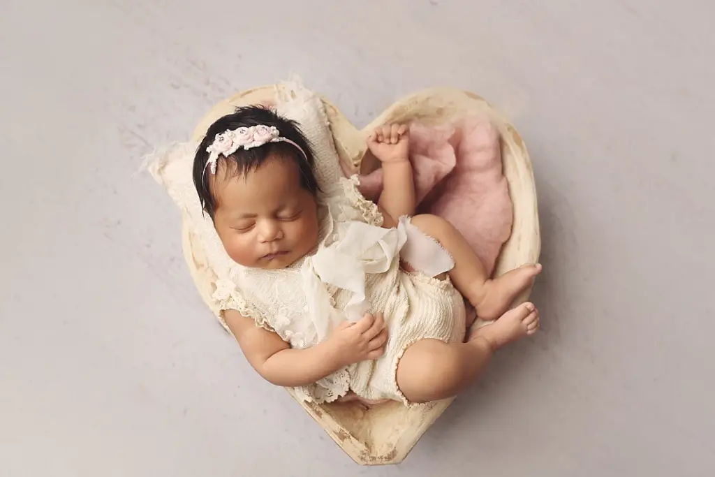 Close-up of newborn baby girl peacefully sleeping during Kansas City newborn photography