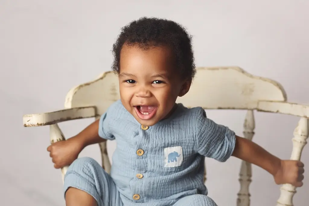 Close-up portrait of baby boy smiling during Kansas City first birthday session