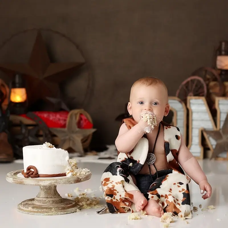 cowboy-cake-smash-kansas-city-studio-session Rustic cowboy first birthday cake smash with baby boy in Kansas City photography studio, testimonial from Emily