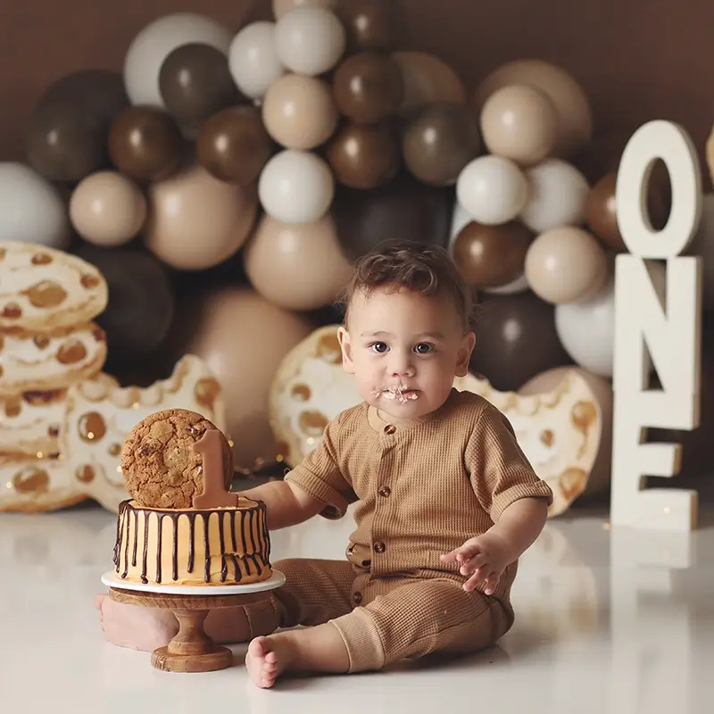 kansas-city-baby-cake-smash-photo First birthday cake smash photo in Kansas city studio with baby celebrating