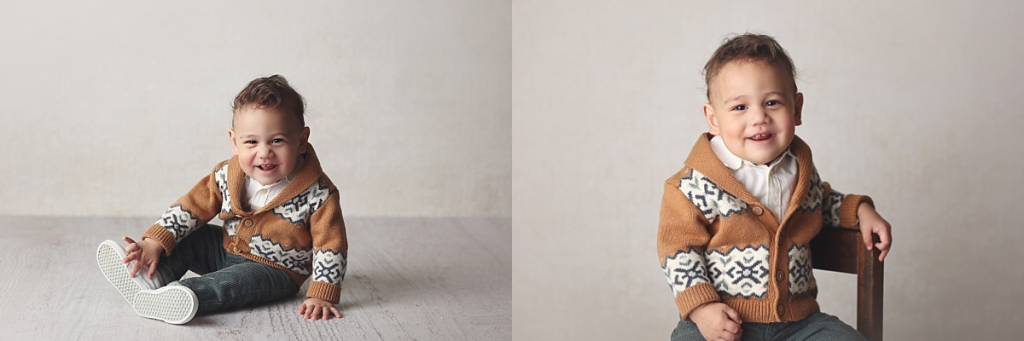 One-year-old boy smiling during first birthday portrait session in Kansas City studio