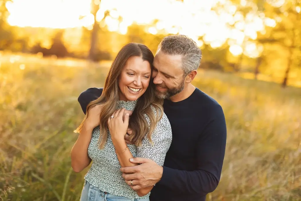 Mom and dad together at fall family photography session in Kansas City