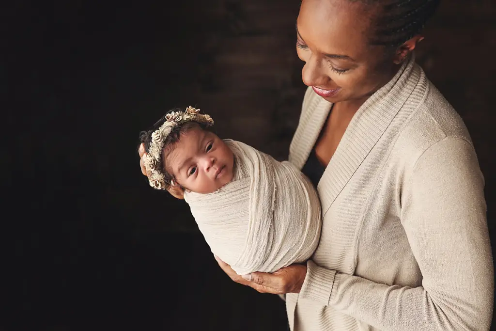 Mother and newborn baby girl captured in timeless Kansas City newborn portraits