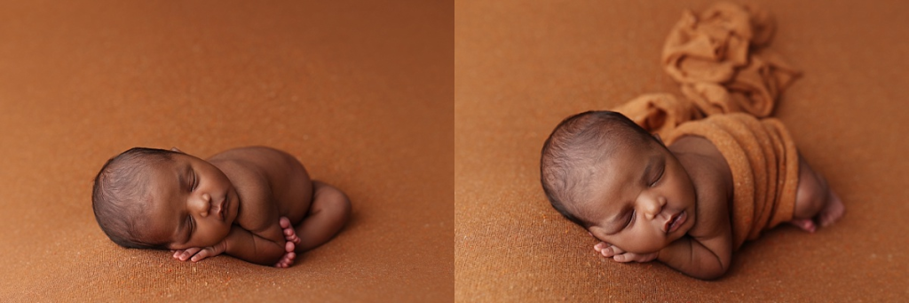 Newborn baby boy swaddled and sleeping on rust-colored fabric in Kansas City newborn studio