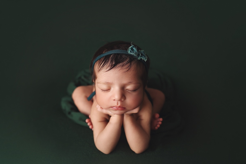 Kansas City newborn photographer luxury portrait of baby girl with bow