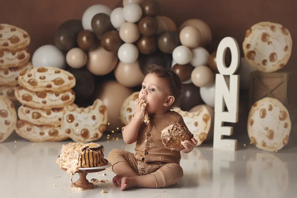 Professional first birthday photos with chocolate chip cookie cake smash at Anna Marie Photography