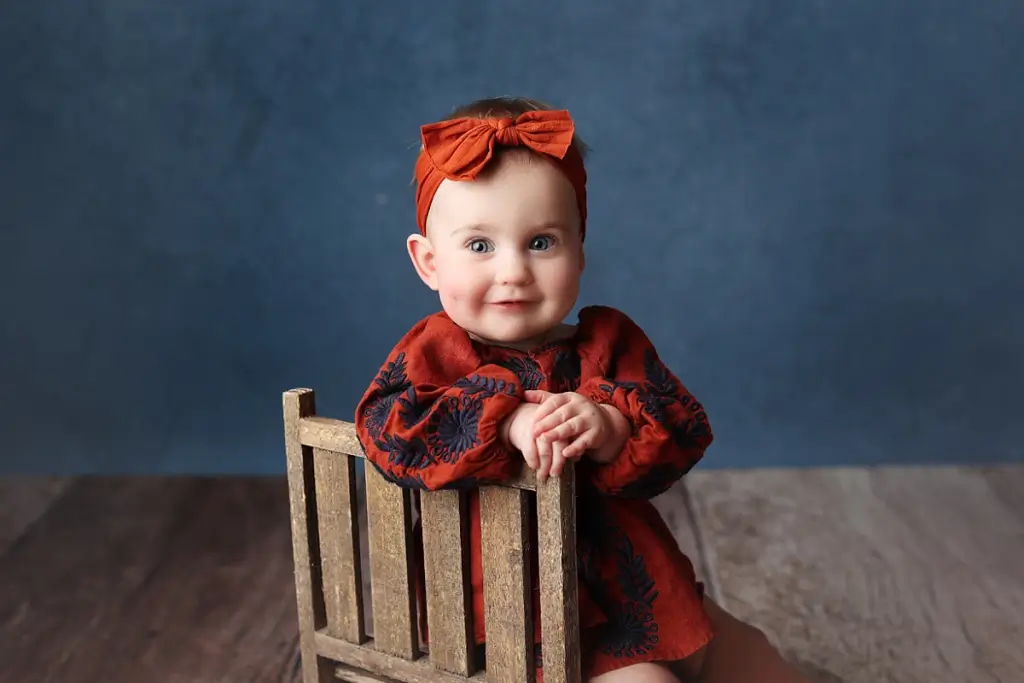 Close-up of baby girl in headband during Kansas City cake smash portraits