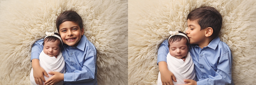 Newborn baby girl swaddled with big brother during Kansas City sibling portraits