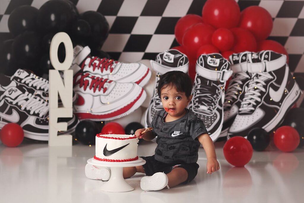 nike sneaker themed cake smash for little boy at kansas city photography studio