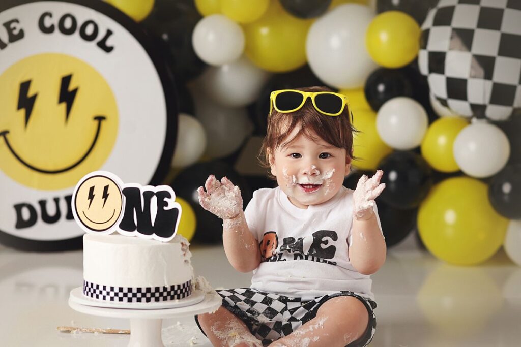 one cool dude cake smash with little boy in sunglasses at kansas city photography studio