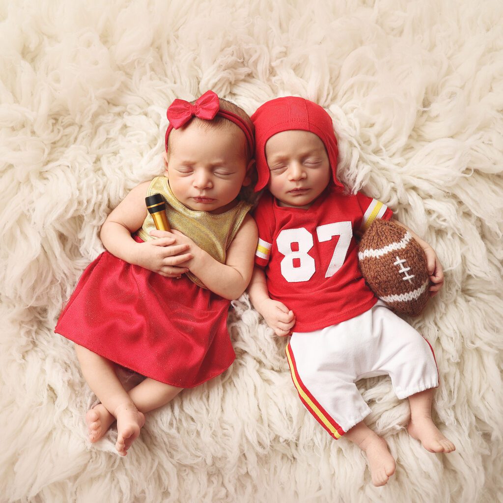 Newborn twins dressed as Taylor Swift and Travis Kelce in Kansas City Chiefs team colors